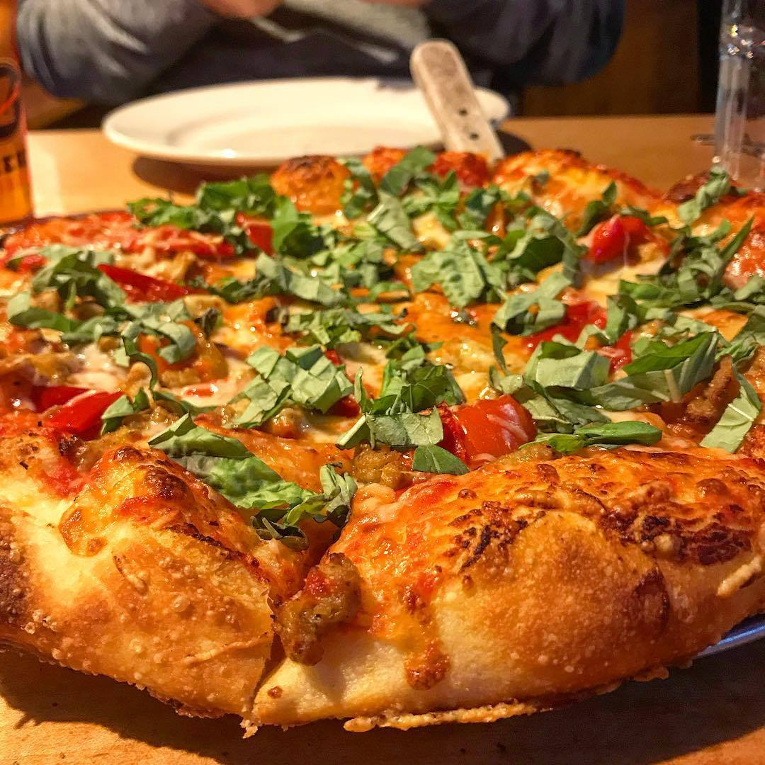 picture of Zeeks pizza served at a restaurant table