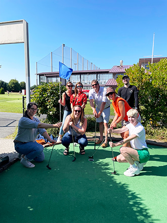 Mentor Creative Group team posing at the Interbay Golfing Center