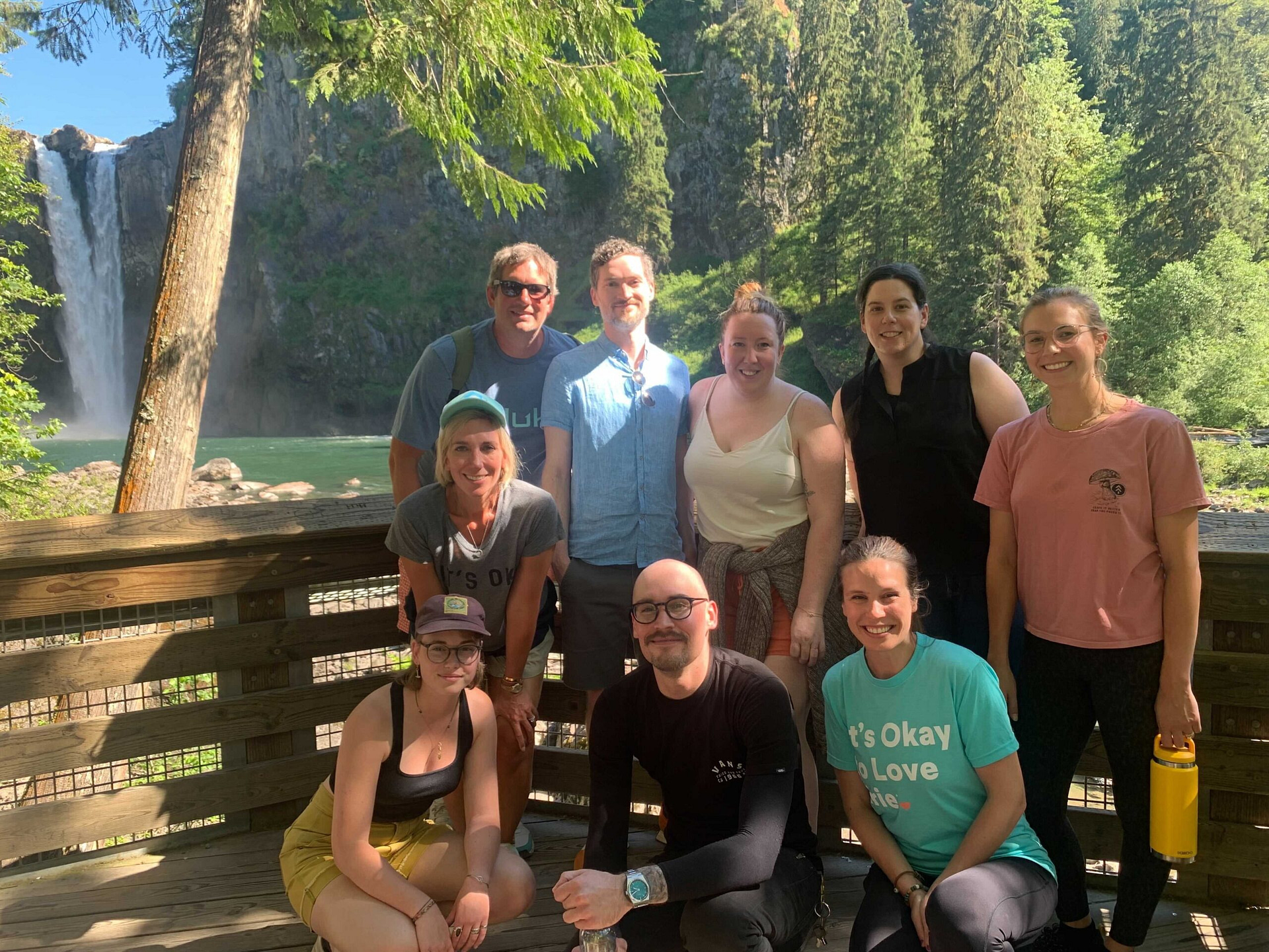 Mentor Creative Group Team posing near the Snoqualmie Falls waterfall